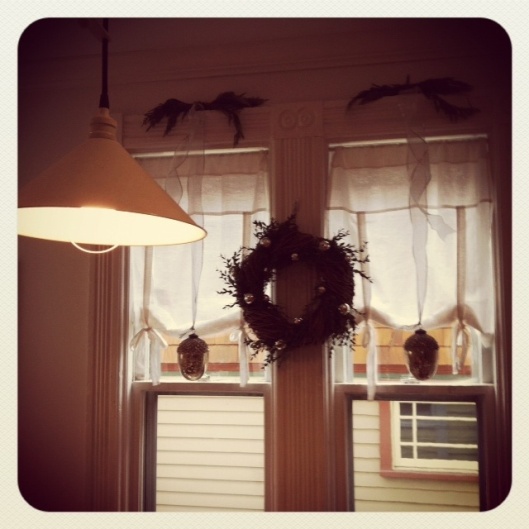 More kitchen windows. You'll never guess where that pretty faux wreath is from! 