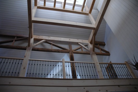 Looking up from the living room through the new cupola. The framework, although aesthetically complete, was designed to eventually support a small staircase and little roost of a room with a glass floor. Maybe the new owners will complete it. 