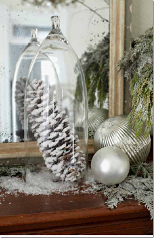 I also love using real pinecones in my winter decor. This idea is cute, enclosing it under a cloche. (I also love using fake snow, like they've done here.  It's also budget- friendly, big impact for the price, and just pretty. You can have a white Christmas anywhere!)